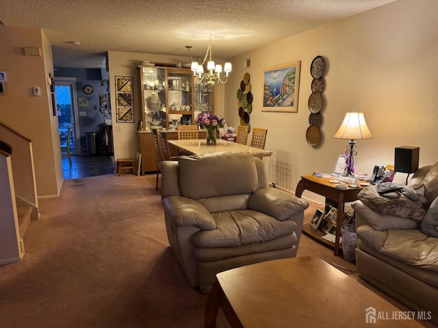 living area featuring visible vents, a notable chandelier, a textured ceiling, stairway, and carpet flooring