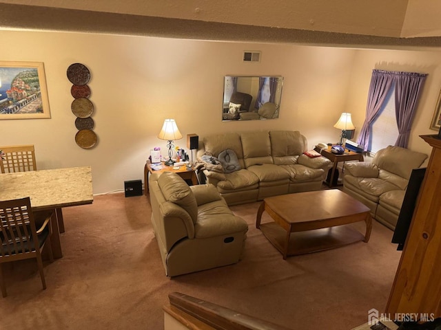 carpeted living area featuring visible vents