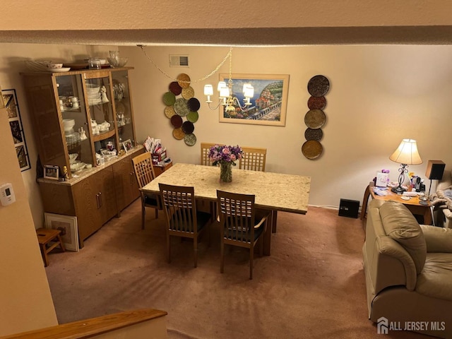 dining area with visible vents and carpet floors