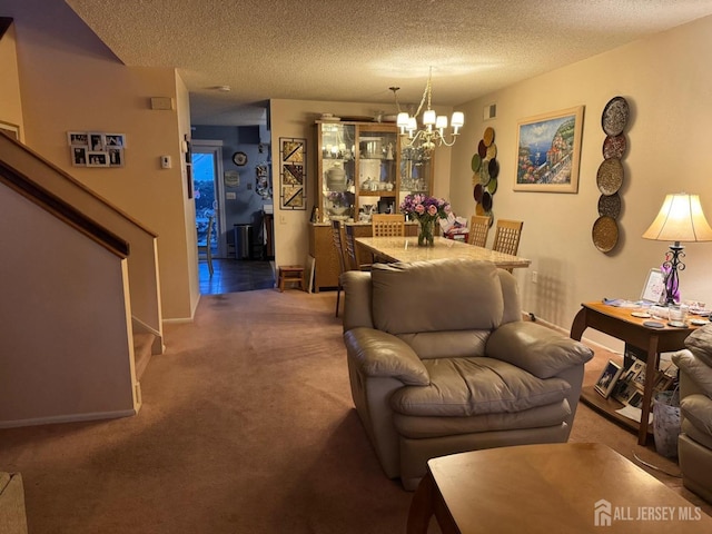 carpeted living room featuring visible vents, a textured ceiling, stairway, an inviting chandelier, and baseboards