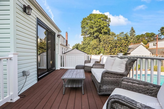 wooden terrace with outdoor lounge area