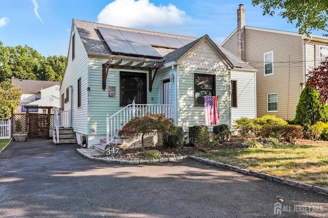 view of front of home with solar panels