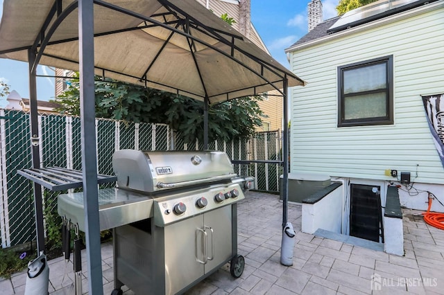 view of patio / terrace featuring area for grilling and a gazebo