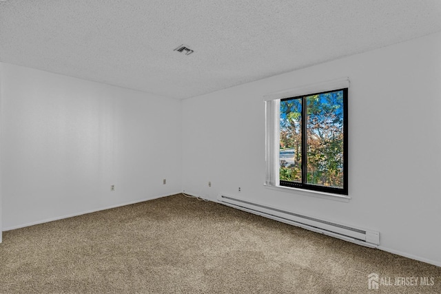6-A Aspen Plz, Monroe, NJ 08831 - spare room featuring a baseboard heating unit, carpet flooring, a textured ceiling, and baseboards