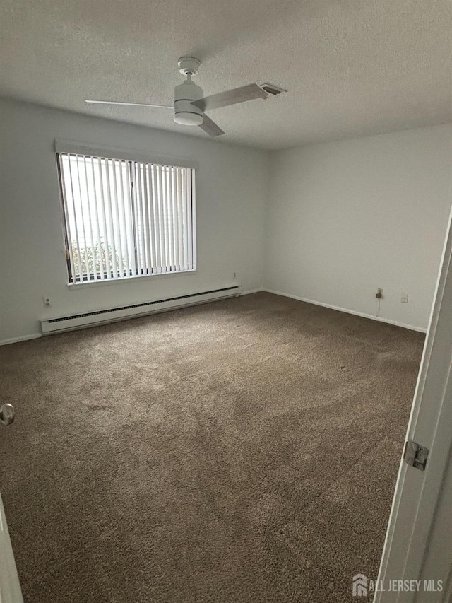 6-A Aspen Plz, Monroe, NJ 08831 - carpeted empty room with baseboard heating, a textured ceiling, and a ceiling fan