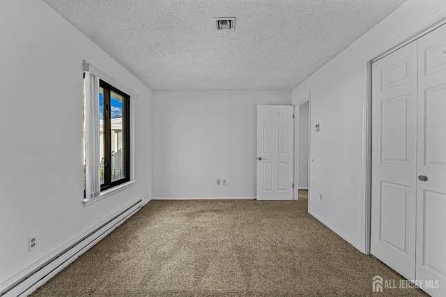 6-A Aspen Plz, Monroe, NJ 08831 - unfurnished bedroom with a baseboard heating unit, carpet, and a textured ceiling