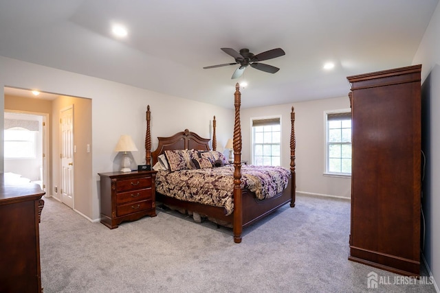 bedroom with light colored carpet, baseboards, a ceiling fan, and recessed lighting