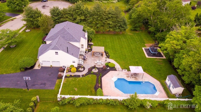 view from above of property with a pool area