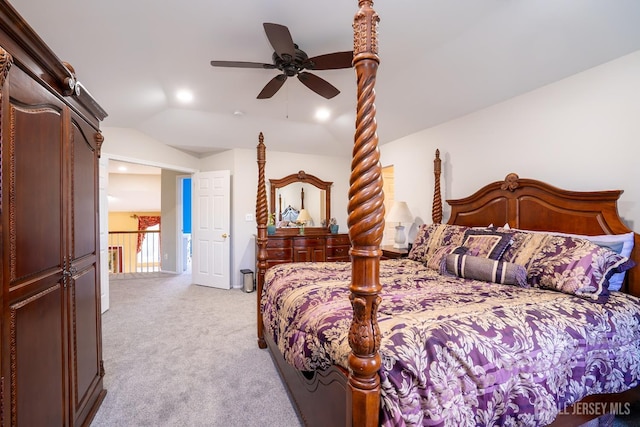 bedroom with vaulted ceiling, light carpet, and ceiling fan