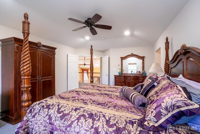 carpeted bedroom featuring lofted ceiling and ceiling fan