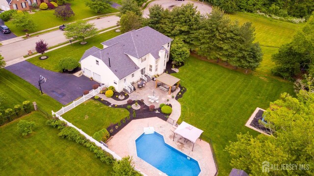 view of subject property featuring a pool area