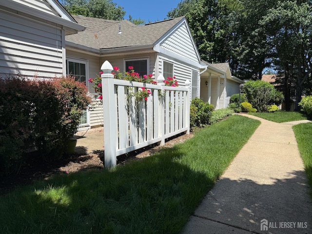306 Kinglet Dr, Monroe, NJ 08831 - view of side of property featuring roof with shingles