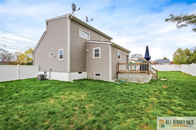back of house with a wooden deck and cooling unit
