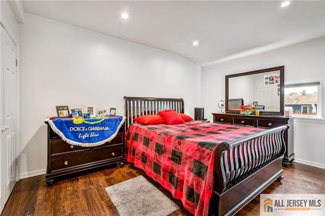 bedroom featuring recessed lighting, wood finished floors, baseboards, and vaulted ceiling