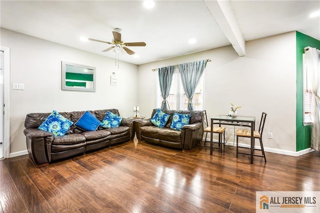 living room featuring wood-type flooring, a ceiling fan, baseboards, beamed ceiling, and recessed lighting