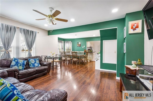 living area featuring ceiling fan, wood finished floors, and recessed lighting