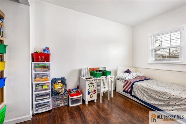 bedroom with wood finished floors