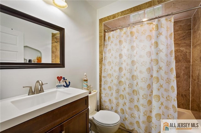 full bath with toilet, vanity, and shower / tub combo