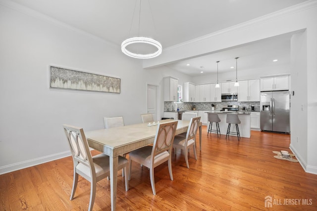 22 Sadowski Dr, Old Bridge, NJ 08857 - dining area with light wood finished floors, crown molding, and recessed lighting
