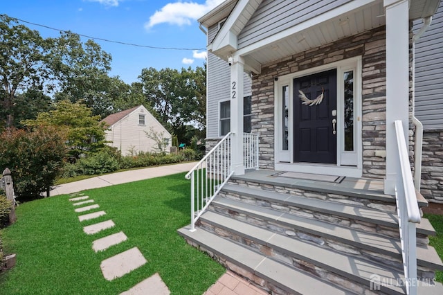 22 Sadowski Dr, Old Bridge, NJ 08857 - property entrance featuring stone siding and a yard
