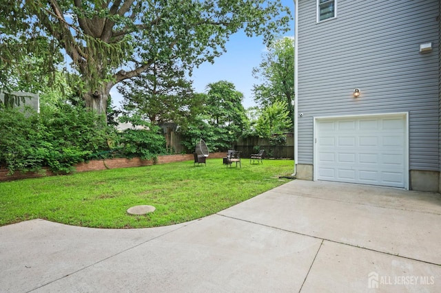 22 Sadowski Dr, Old Bridge, NJ 08857 - view of grassy yard with concrete driveway and a garage