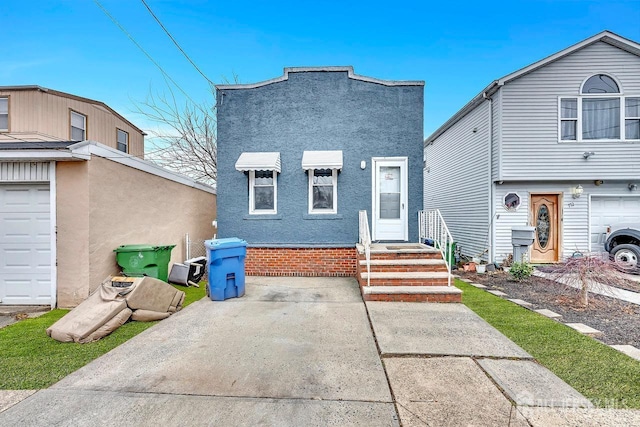 view of front of house featuring stucco siding and entry steps