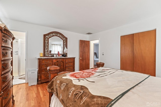 bedroom with a closet and light wood-type flooring