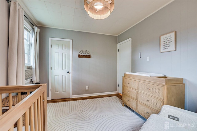 414 Graham St, Highland Park, NJ 08904 - bedroom featuring crown molding and wood finished floors