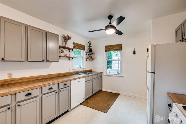 414 Graham St, Highland Park, NJ 08904 - kitchen featuring white appliances, gray cabinets, light floors, and ceiling fan