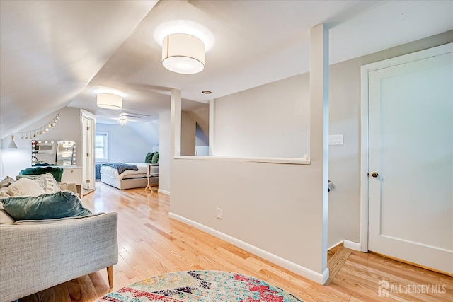 414 Graham St, Highland Park, NJ 08904 - living room featuring light wood finished floors and vaulted ceiling