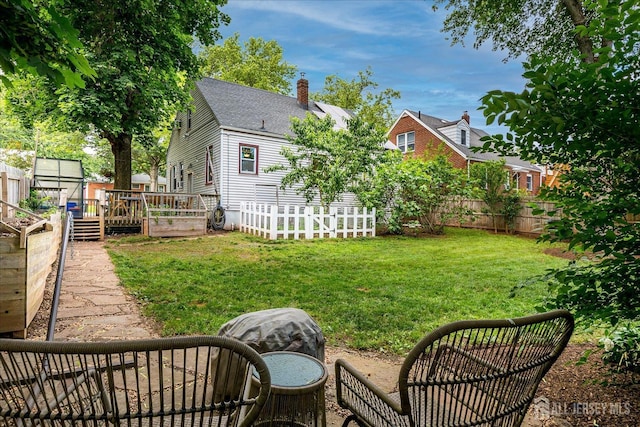 414 Graham St, Highland Park, NJ 08904 - fenced backyard with a deck