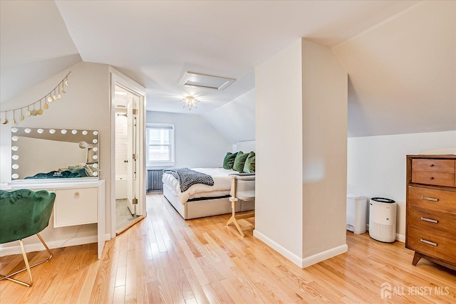 414 Graham St, Highland Park, NJ 08904 - bedroom with attic access, vaulted ceiling, wood finished floors, and radiator heating unit
