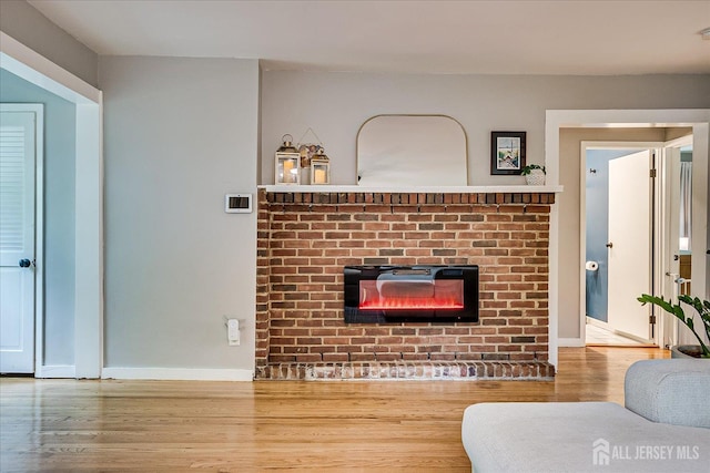 414 Graham St, Highland Park, NJ 08904 - living area featuring a fireplace and wood finished floors