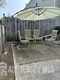 318 High St, Perth Amboy, NJ 08861 - fenced backyard with a patio