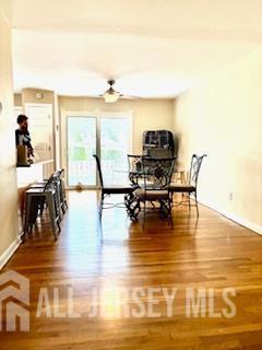 318 High St, Perth Amboy, NJ 08861 - dining room with wood finished floors and baseboards