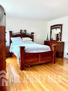 318 High St, Perth Amboy, NJ 08861 - bedroom featuring light wood-style flooring