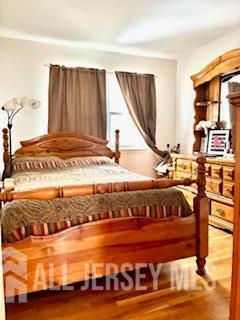 318 High St, Perth Amboy, NJ 08861 - bedroom with wood finished floors
