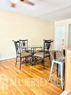 318 High St, Perth Amboy, NJ 08861 - dining area featuring ceiling fan and light wood-style flooring