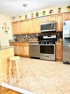 318 High St, Perth Amboy, NJ 08861 - kitchen with stainless steel appliances and backsplash