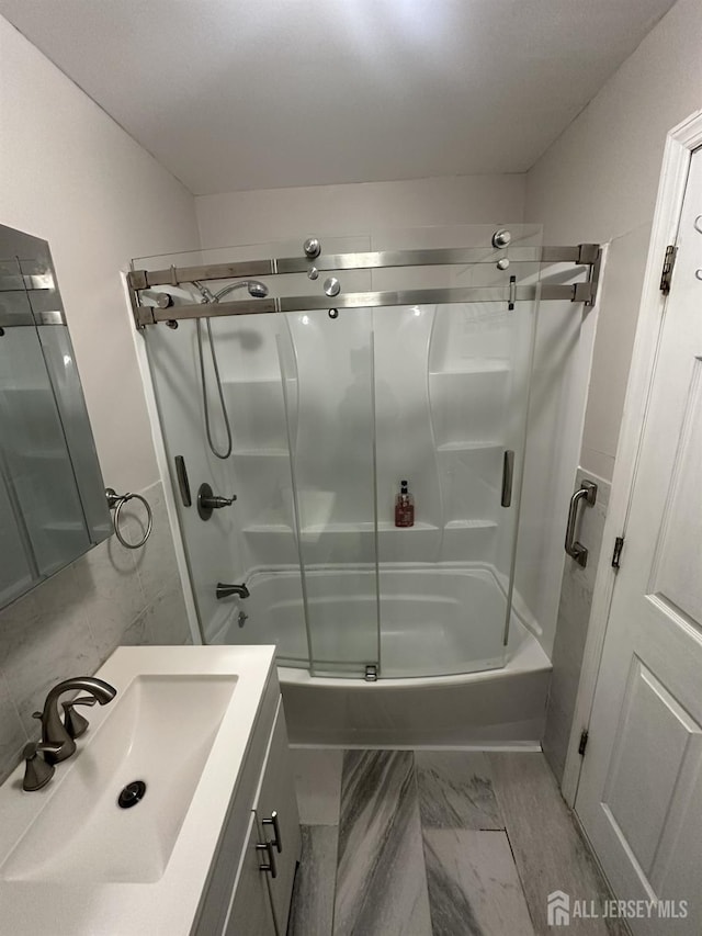 741 S Middlesex Ave S, Colonia, NJ 07067 - full bathroom with vanity, bath / shower combo with glass door, and marble finish floors