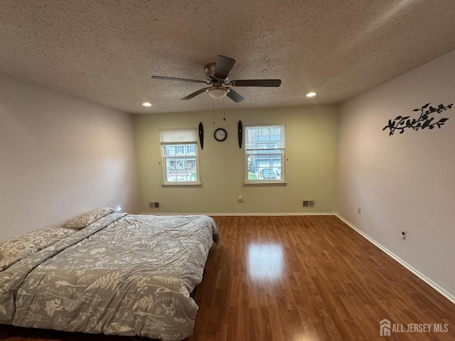 741 S Middlesex Ave S, Colonia, NJ 07067 - bedroom featuring a textured ceiling, wood finished floors, baseboards, recessed lighting, and ceiling fan