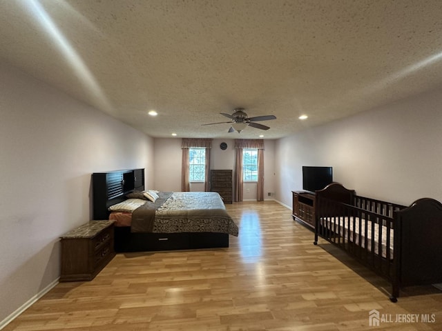 741 S Middlesex Ave S, Colonia, NJ 07067 - bedroom featuring light wood-type flooring, recessed lighting, baseboards, a textured ceiling, and ceiling fan