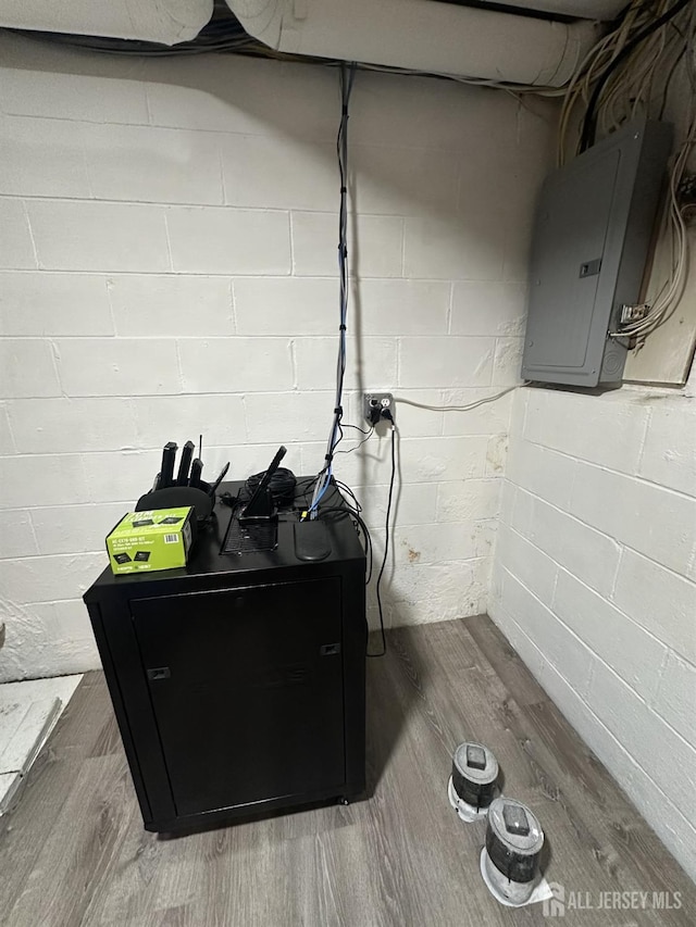 741 S Middlesex Ave S, Colonia, NJ 07067 - detailed view of electric panel, wood finished floors, and concrete block wall