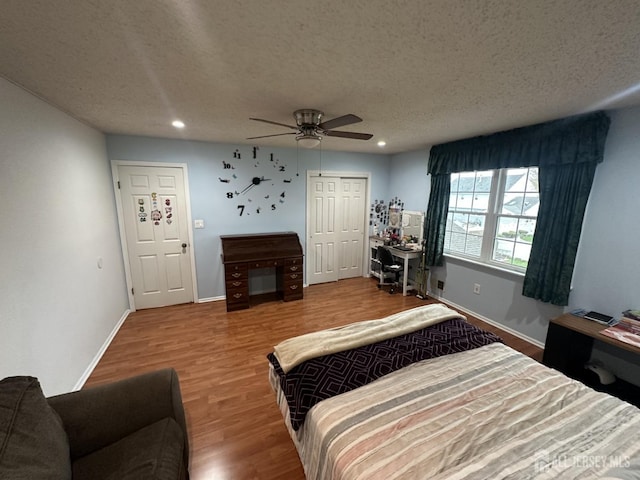 741 S Middlesex Ave S, Colonia, NJ 07067 - bedroom featuring wood finished floors, a textured ceiling, recessed lighting, a ceiling fan, and a closet