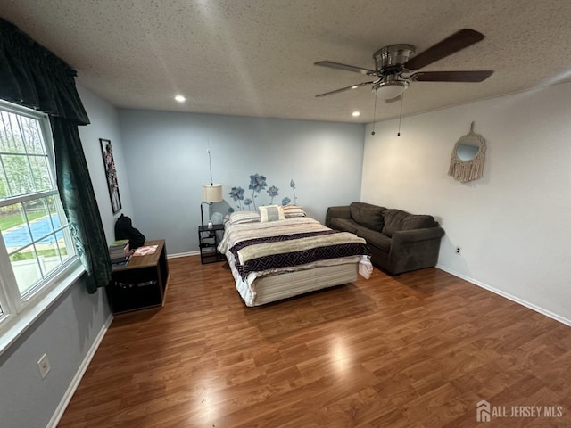 741 S Middlesex Ave S, Colonia, NJ 07067 - bedroom with a textured ceiling, baseboards, wood finished floors, recessed lighting, and ceiling fan