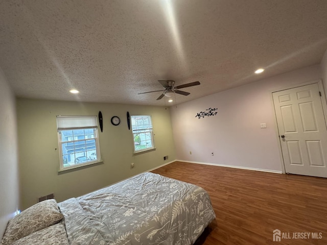741 S Middlesex Ave S, Colonia, NJ 07067 - bedroom with wood finished floors, a textured ceiling, recessed lighting, baseboards, and ceiling fan