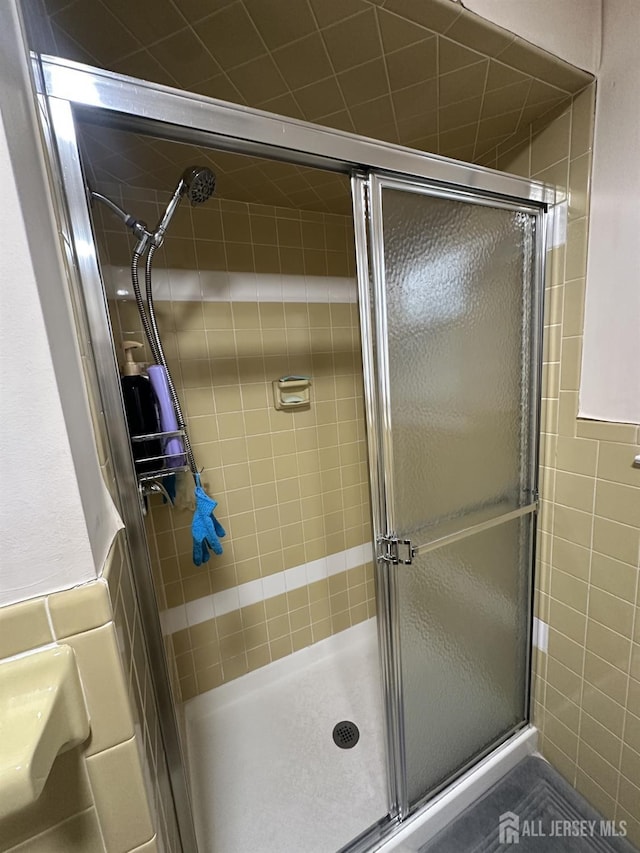 741 S Middlesex Ave S, Colonia, NJ 07067 - bathroom featuring tile walls and a shower stall