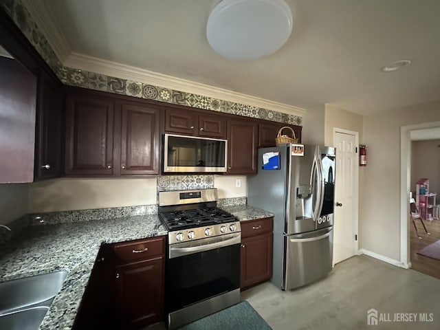 741 S Middlesex Ave S, Colonia, NJ 07067 - kitchen featuring stainless steel appliances, light wood-type flooring, a sink, light stone counters, and ornamental molding