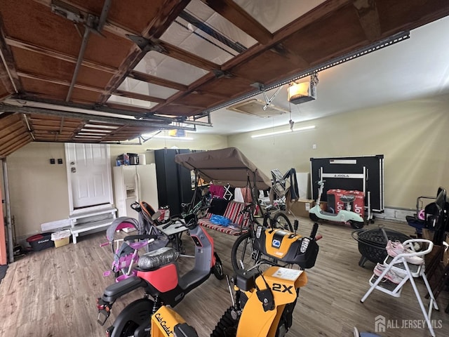 741 S Middlesex Ave S, Colonia, NJ 07067 - garage with a garage door opener and white fridge with ice dispenser
