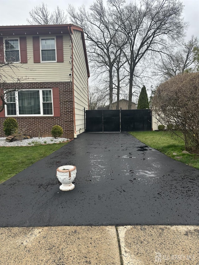 741 S Middlesex Ave S, Colonia, NJ 07067 - view of side of home featuring brick siding and asphalt driveway